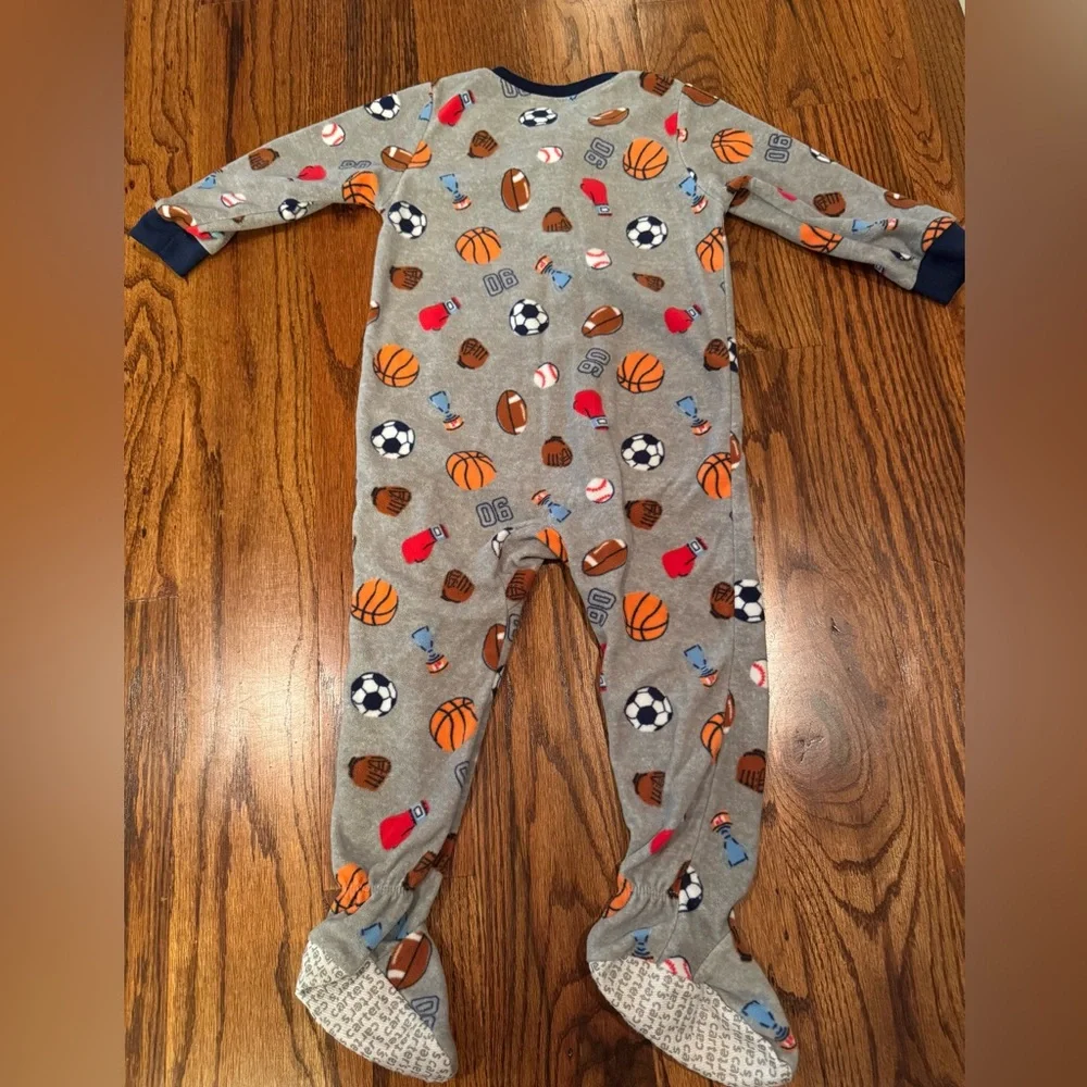Pair of Carter's fleece PJs with zipper and footies.  Size 24 Months